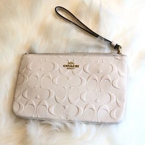 COACH embossed wristlet
